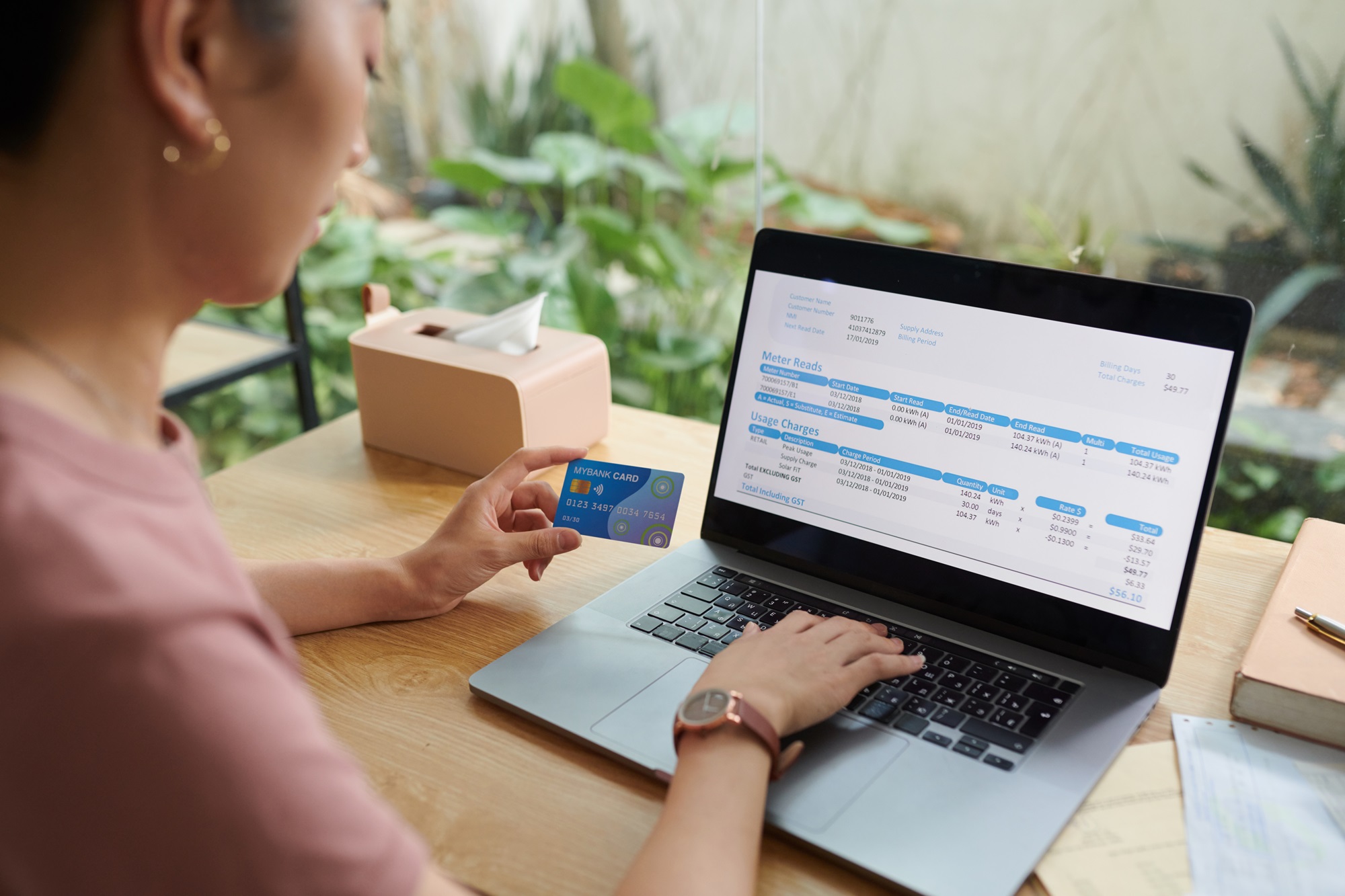 a woman looking at bills online