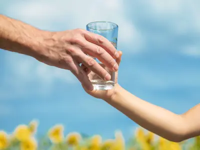 handing a glass of water