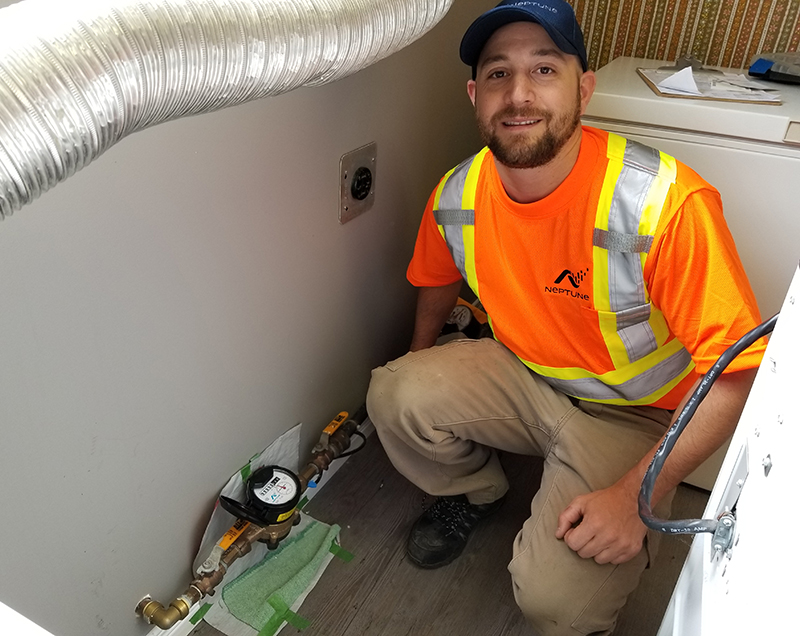 a man installing water meter