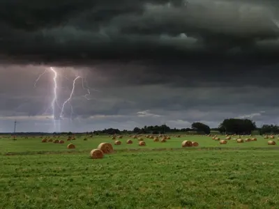 a lightning storm in a hay field