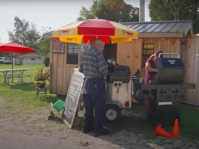 A man being served at a food truck