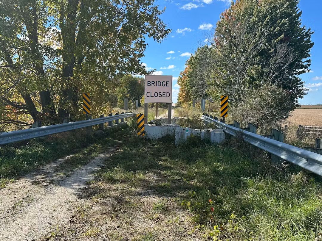 A rural bridge with a ridge closed sign
